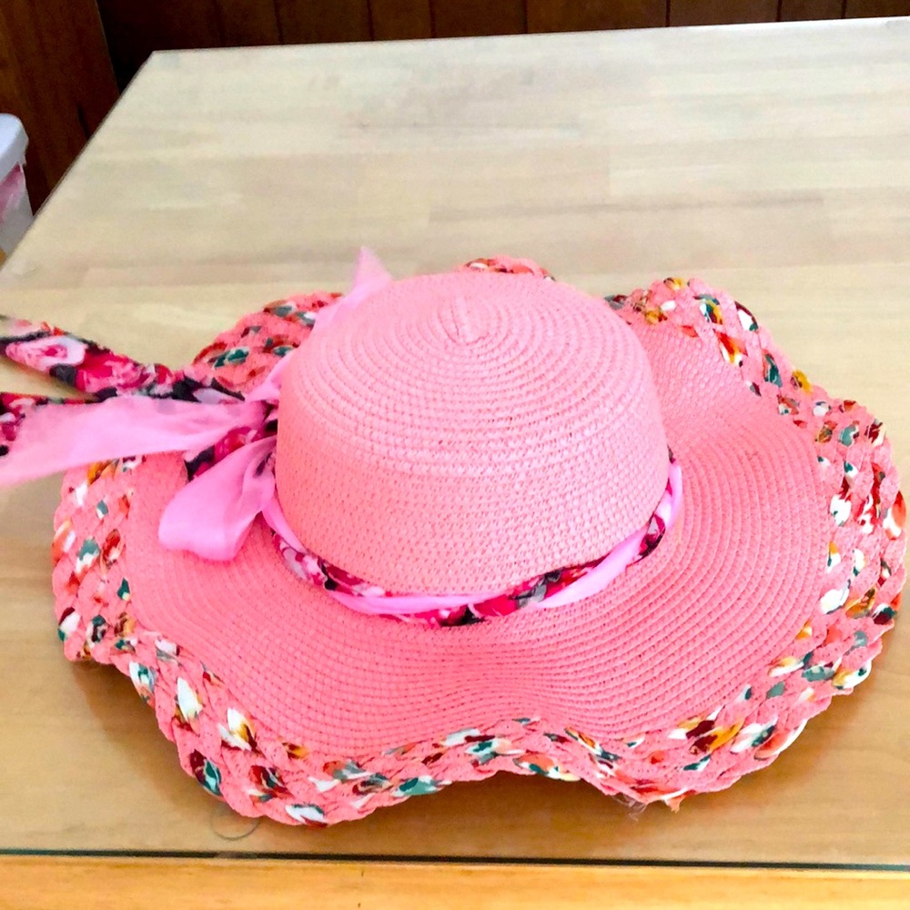 Wide brim, pink straw hat. Perfect for the beach or walking on a hot day.
